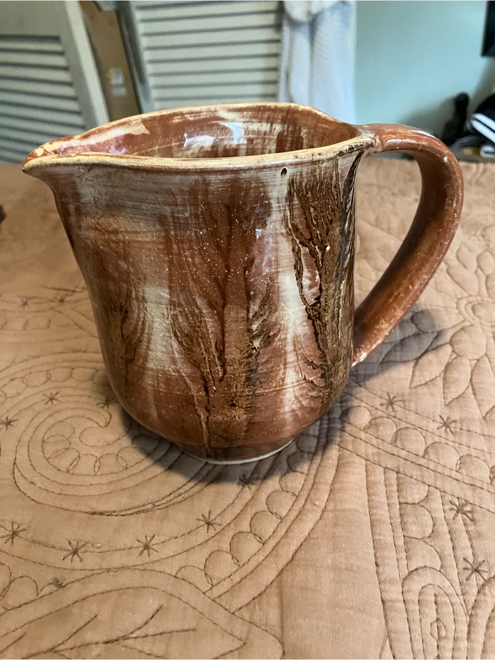 Handcrafted Brown Ceramic Pitcher Featuring a Brown and Cream Glaze